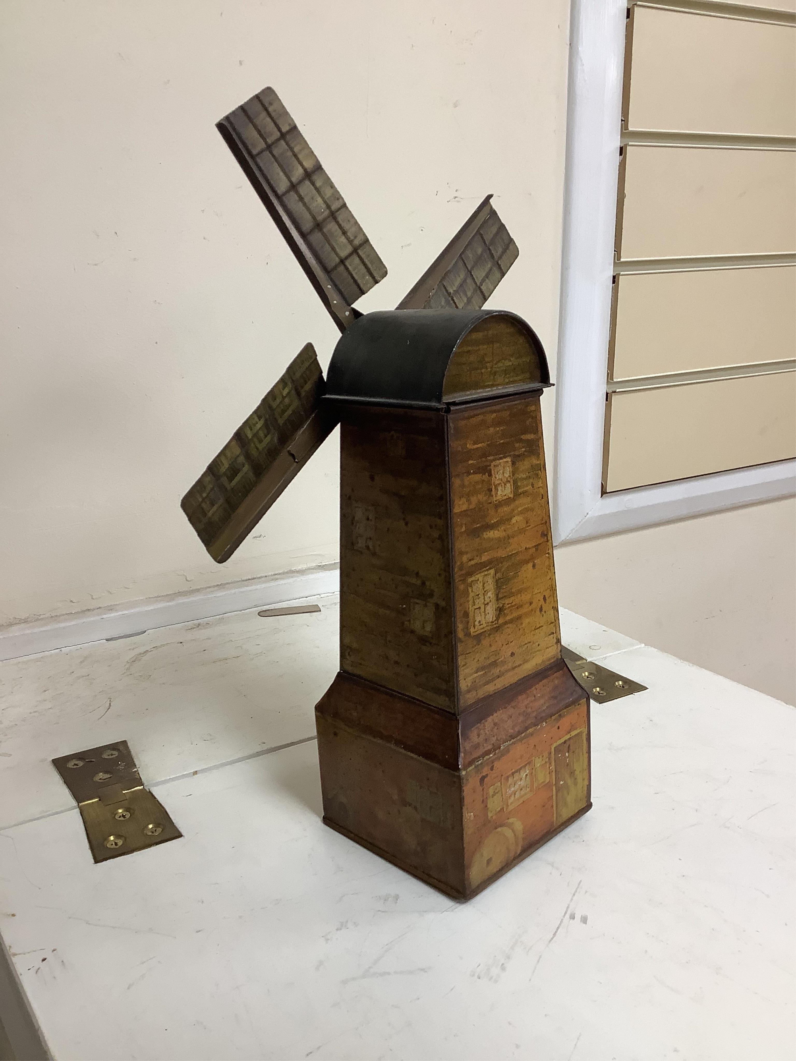 A Windmill biscuit tin by Huntley & Palmer: Reading & London, 'BIVM' Eastern Beauties tea tin and Huntley & Palmers triangular biscuit tin with 'Sports' motifs